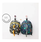 Children's anti-loss safety backpack with dinosaur-shaped safety belt.