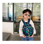 Children's anti-loss safety backpack with dinosaur-shaped safety belt.
