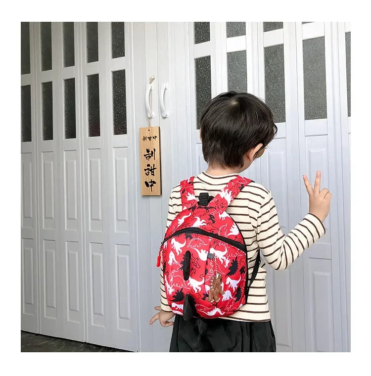 Children's anti-loss safety backpack with dinosaur-shaped safety belt.