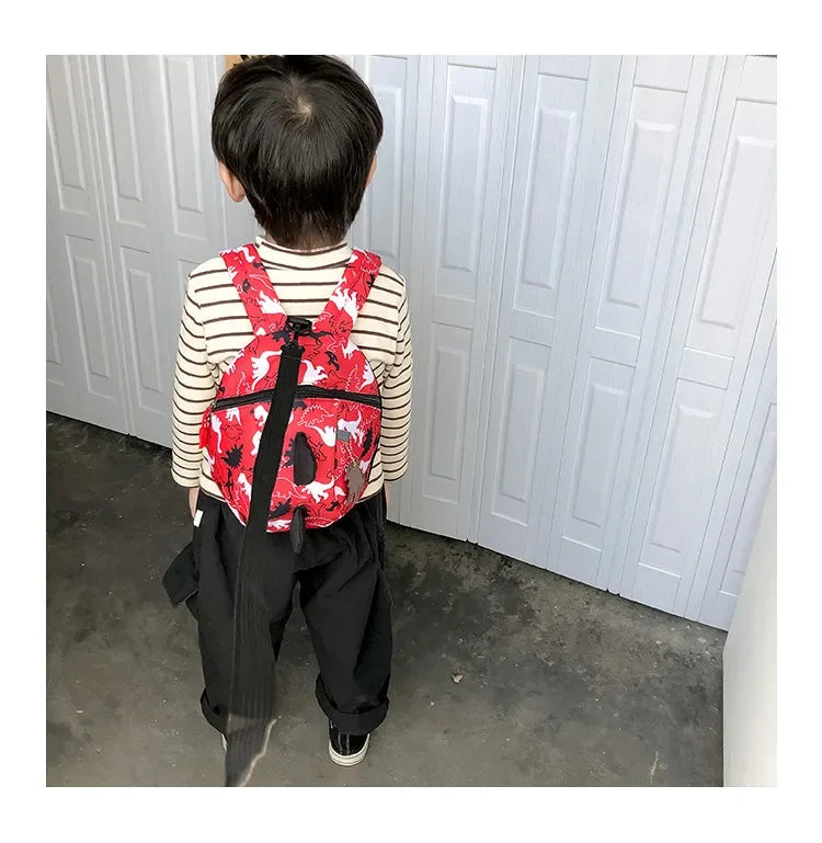 Children's anti-loss safety backpack with dinosaur-shaped safety belt.